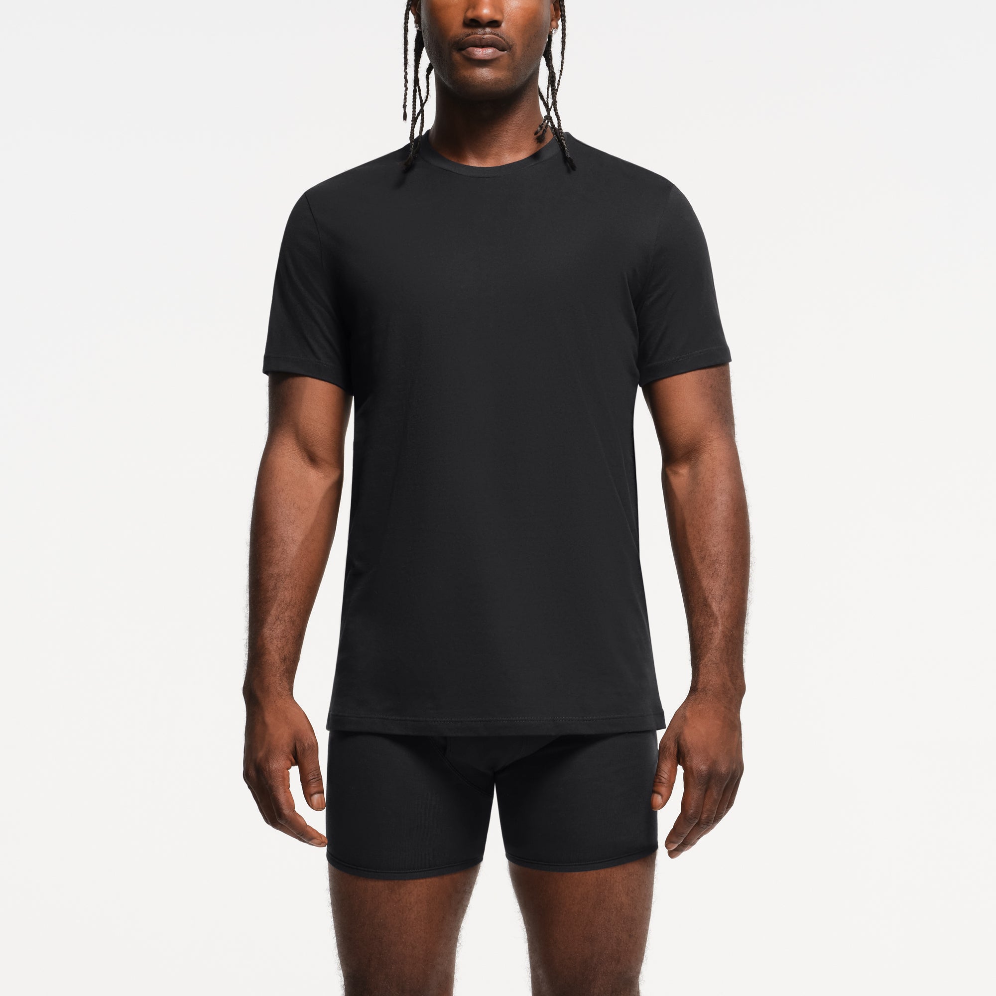 SKIMS BASICS MENS LIGHTWEIGHT T-SHIRT 3-PACK | OBSIDIAN ON A MODEL FRONT VIEW