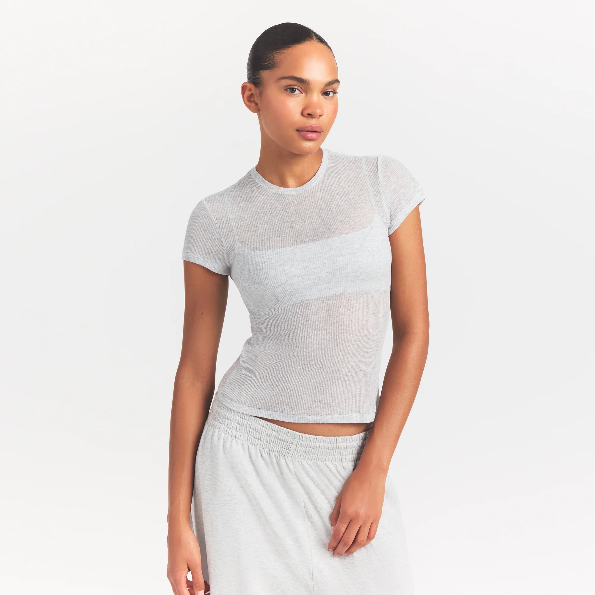 SHEER RIB T-SHIRT | LIGHT HEATHER GREY ON A MODEL SIDE VIEW @ | FOCUS: 0.0, 1.0, 0.9