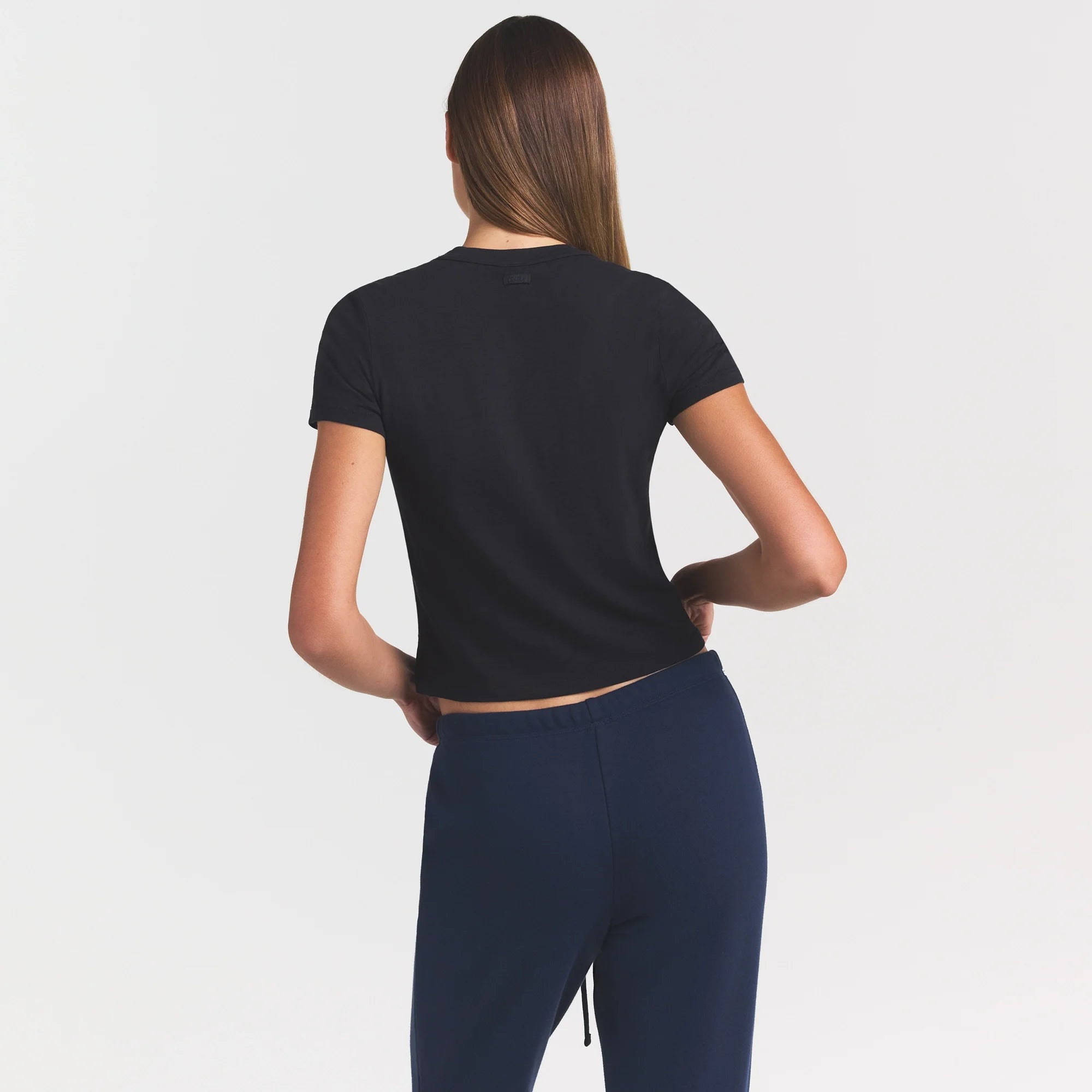 WORN IN JERSEY BABY V NECK TEE | WASHED ONYX ON A MODEL SIDE VIEW @ | FOCUS: 0.0, 1.0, 0.9