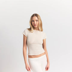 FEATHERWEIGHT CASHMERE TEE | EGRET ON A MODEL SIDE VIEW S | FOCUS: 0.0, 1.0, 0.9