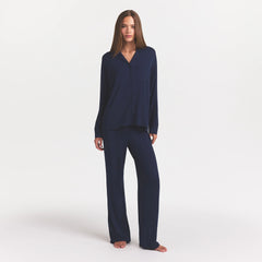 SKIMS SLEEP LONG SLEEVE BUTTON UP SET | NAVY ON A MODEL FRONT VIEW @ | FOCUS: 0.0, 1.0, 0.9