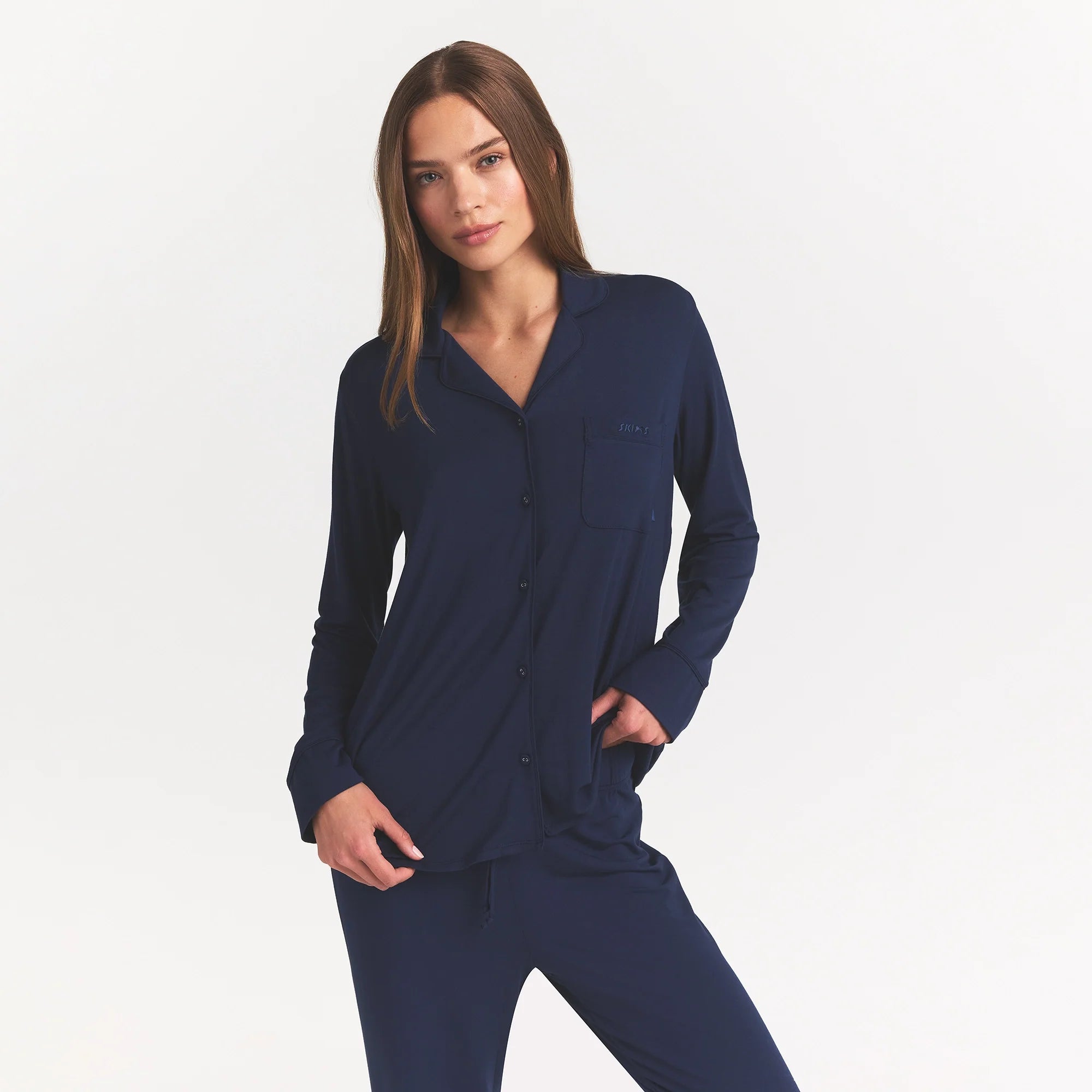 SKIMS SLEEP LONG SLEEVE BUTTON UP SET | NAVY ON A MODEL FRONT VIEW @ | FOCUS: 0.0, 1.0, 0.9