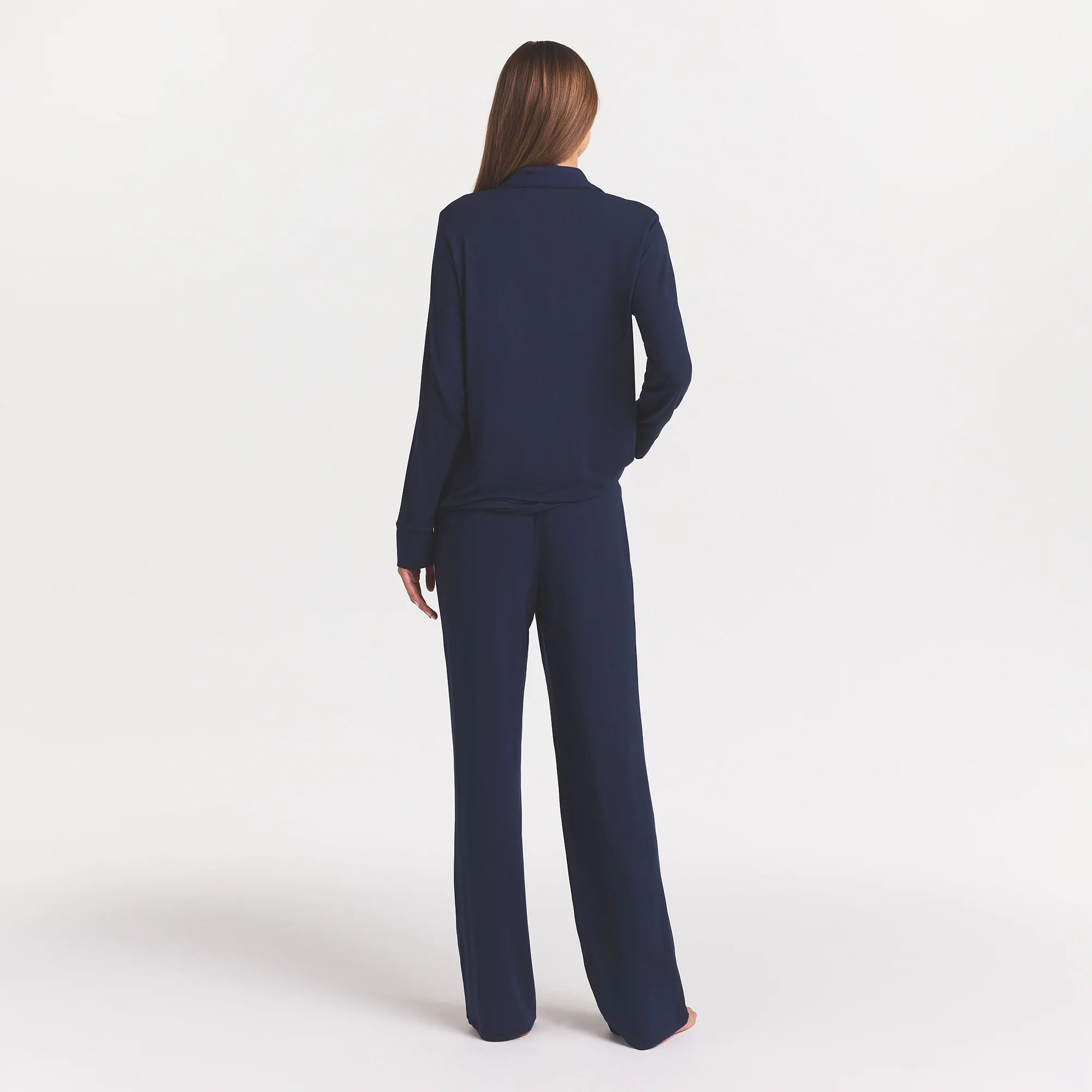 SKIMS SLEEP LONG SLEEVE BUTTON UP SET | NAVY ON A MODEL FRONT VIEW @ | FOCUS: 0.0, 1.0, 0.9