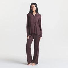 SKIMS SLEEP LONG SLEEVE BUTTON UP SET | RAISIN ON A MODEL FRONT VIEW @ | FOCUS: 0.0, 1.0, 0.9