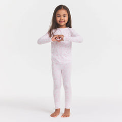 SKIMS SLEEP KIDS SLEEP SET | SNOW DELICATE FLORAL PRINT ON A MODEL FRONT VIEW @ | FOCUS: 0.0, 1.0, 0.9