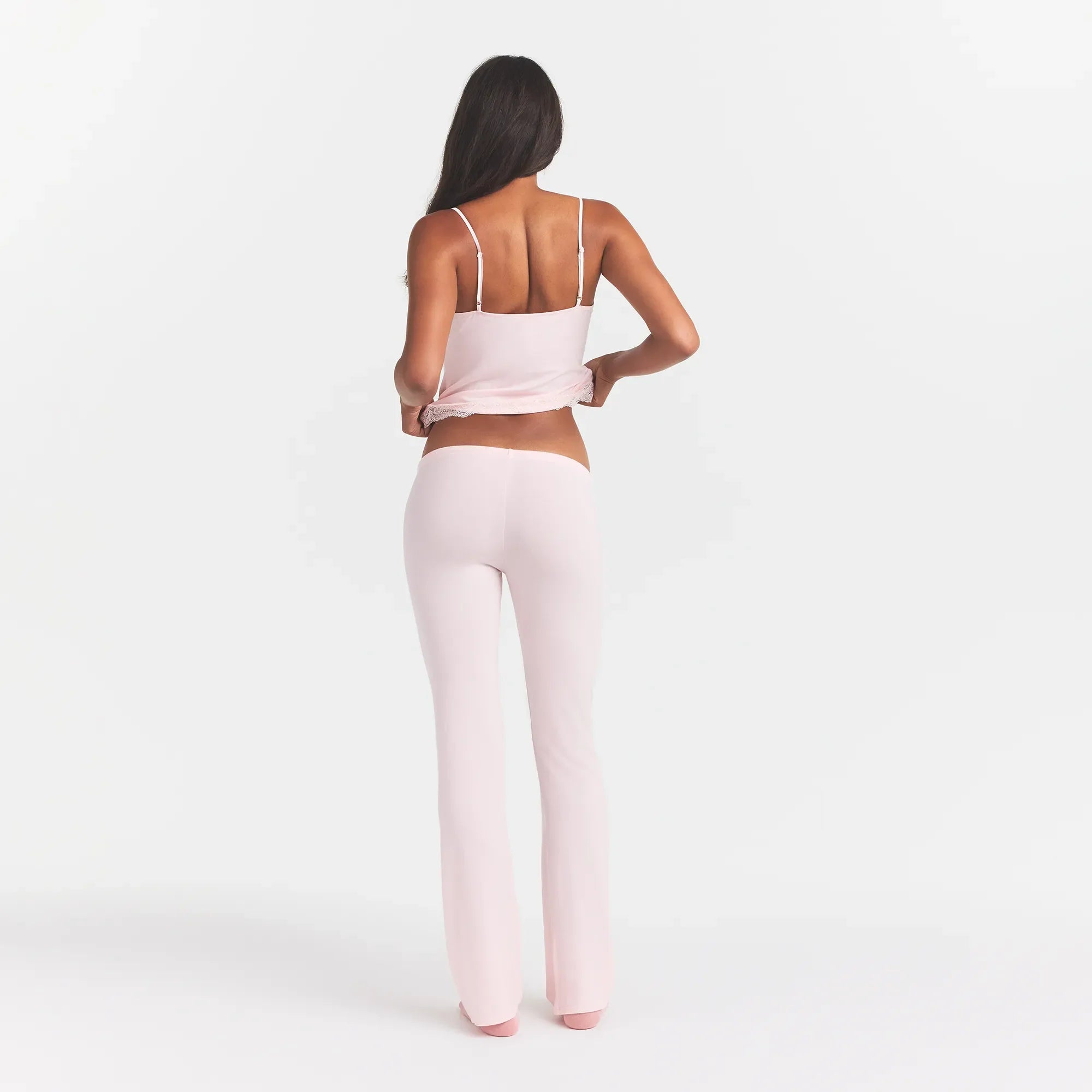 SKIMS SLEEP LACE CAMI AND PANT SET | BARELY PINK ON A MODEL BACK VIEW @ | FOCUS: 0.0, 1.0, 0.9