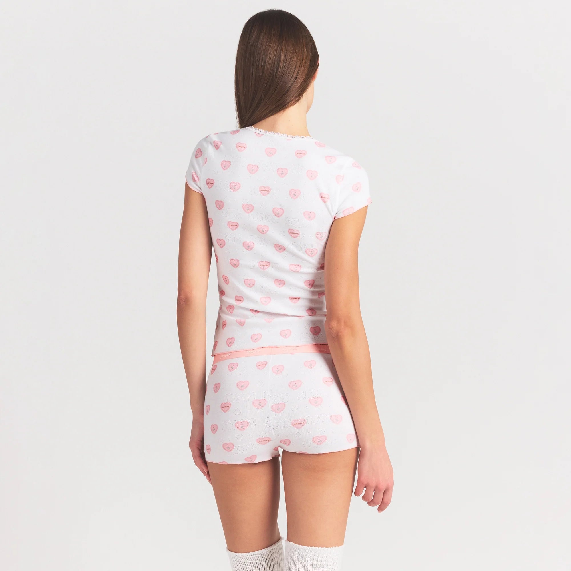 LOGO POINTELLE BABY TEE AND SHORT SET | SNOW LACE HEARTS ON A MODEL SIDE VIEW @ | FOCUS: 0.0, 1.0, 0.9