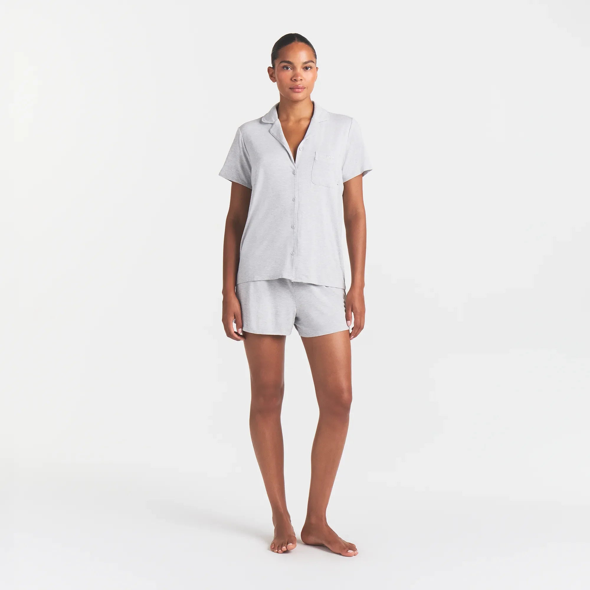 SKIMS SLEEP SHORT SLEEVE BUTTON UP SET | LIGHT HEATHER GREY ON A MODEL FRONT VIEW