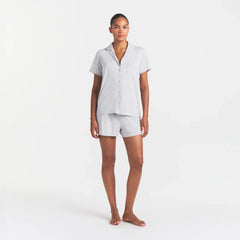 SKIMS SLEEP SHORT SLEEVE BUTTON UP SET | LIGHT HEATHER GREY ON A MODEL FRONT VIEW
