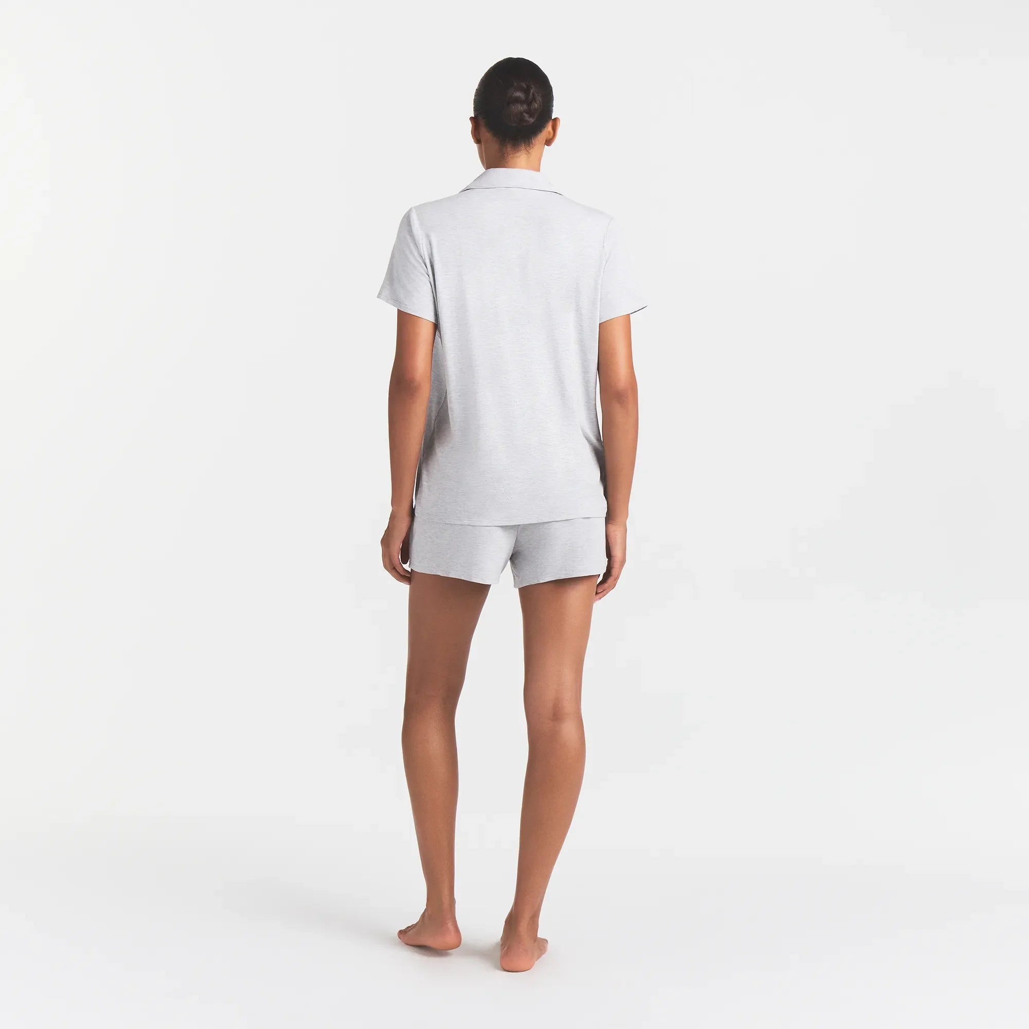 SKIMS SLEEP SHORT SLEEVE BUTTON UP SET | LIGHT HEATHER GREY ON A MODEL BACK VIEW