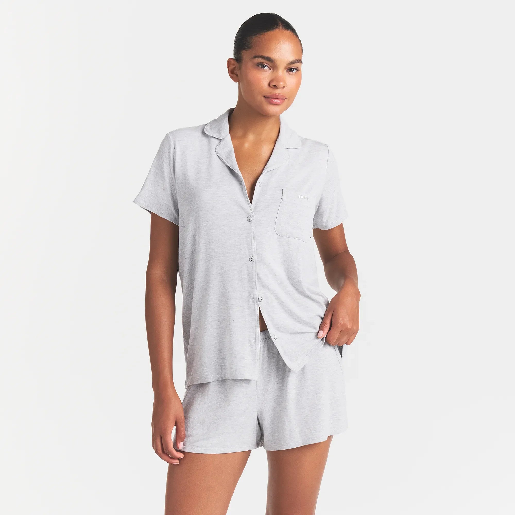 SKIMS SLEEP SHORT SLEEVE BUTTON UP SET | LIGHT HEATHER GREY ON A MODEL FRONT VIEW