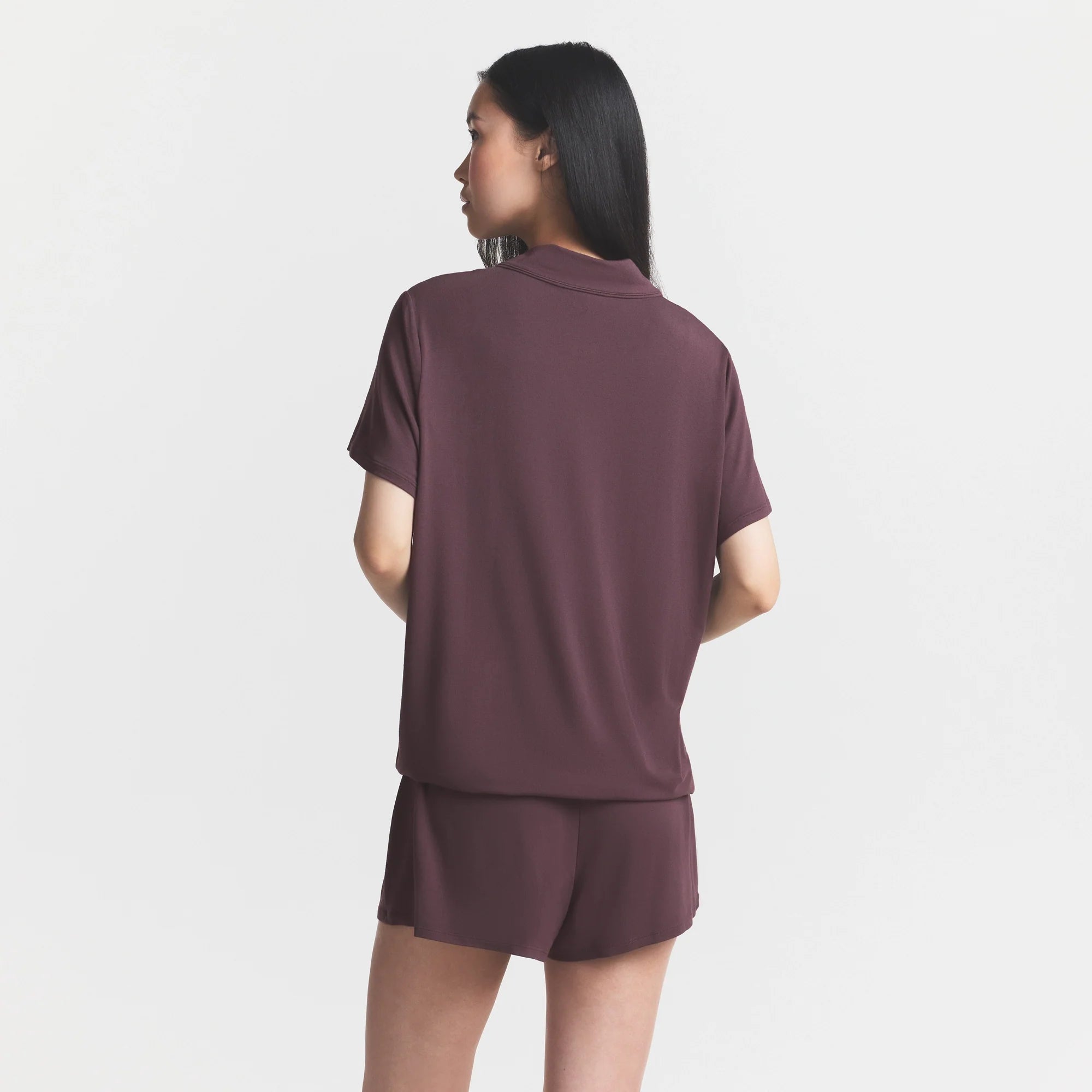 SKIMS SLEEP SHORT SLEEVE BUTTON UP SET | RAISIN ON A MODEL SIDE VIEW @ | FOCUS: 0.0, 1.0, 0.9
