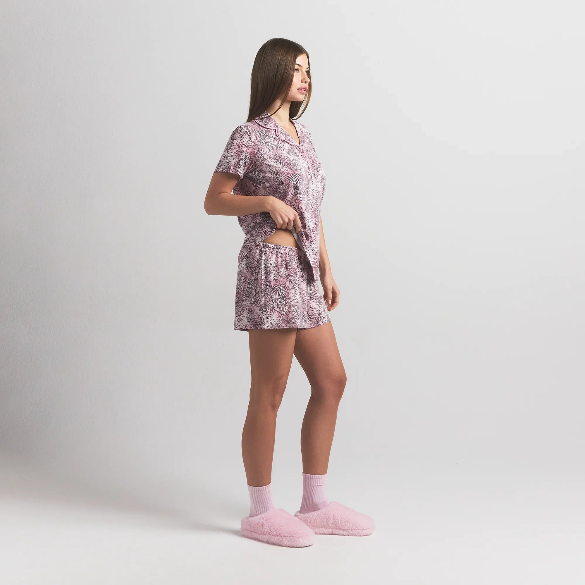 SKIMS SLEEP SHORT SLEEVE BUTTON UP SET | BLOOM MINI MULTI ANIMAL ON A MODEL SIDE VIEW @ | FOCUS: 0.0, 1.0, 0.9