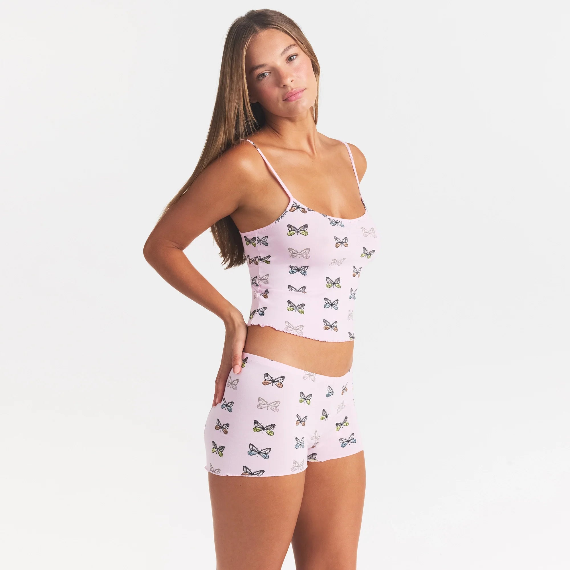 SKIMS SLEEP CAMI SET | PEONY BUTTERFLY PRINT ON A MODEL SIDE VIEW @ | FOCUS: 0.0, 1.0, 0.9