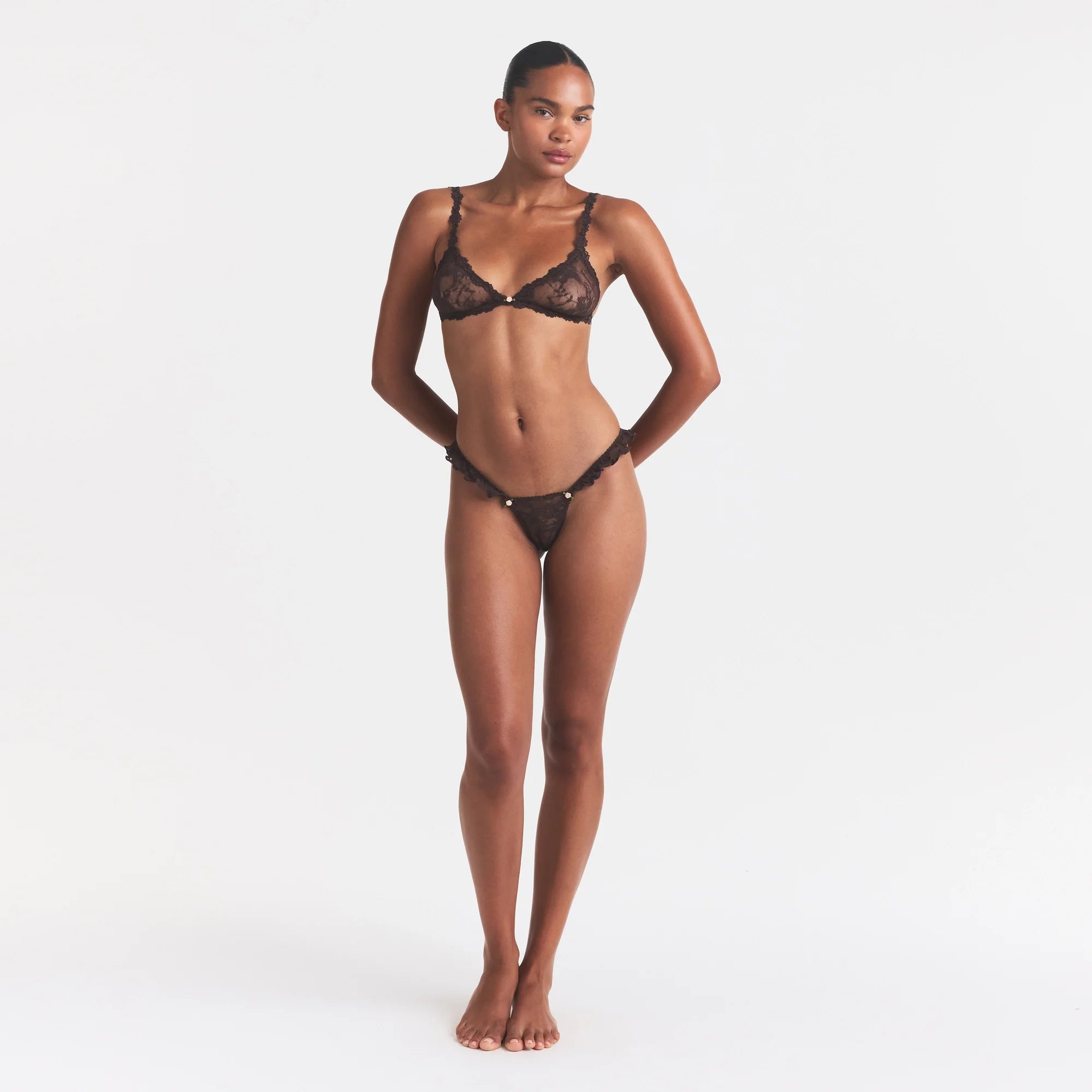 STRETCH LACE BUTTERFLY THONG | ESPRESSO ON A MODEL FRONT VIEW @ | FOCUS: 0.0, 1.0, 0.9