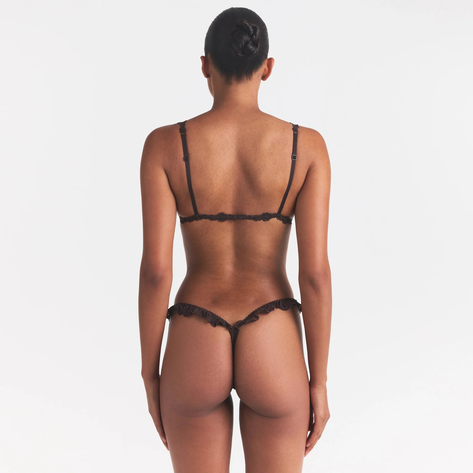 STRETCH LACE BUTTERFLY THONG | ESPRESSO ON A MODEL SIDE VIEW @ | FOCUS: 0.0, 1.0, 0.9