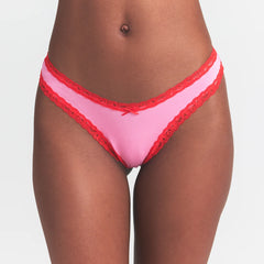 LIGHTWEIGHT COTTON LACE THONG | CARNATION CONTRAST ON A MODEL FRONT VIEW @ | FOCUS: 0.0, 1.0, 0.9