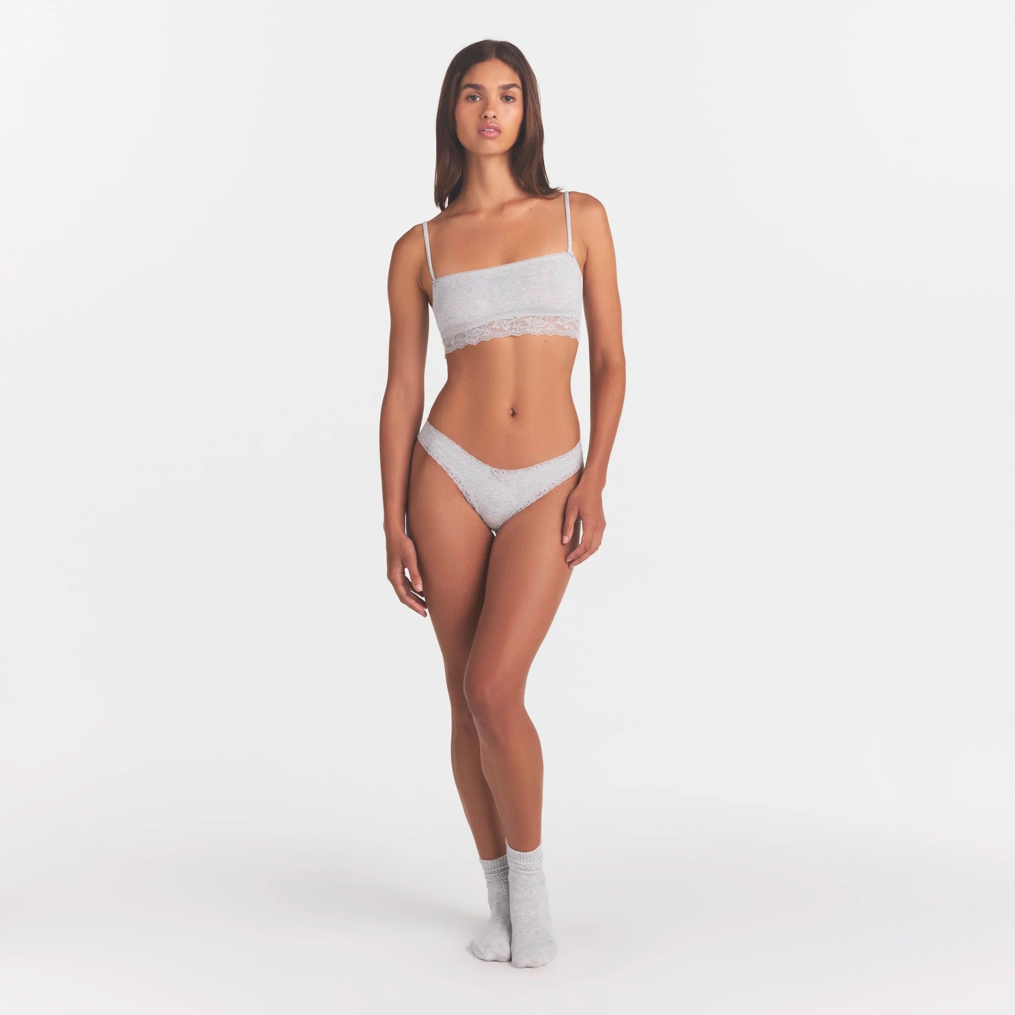 LIGHTWEIGHT COTTON LACE THONG | LIGHT HEATHER GREY ON A MODEL FRONT VIEW | FOCUS: 0.0, 1.0, 0.9