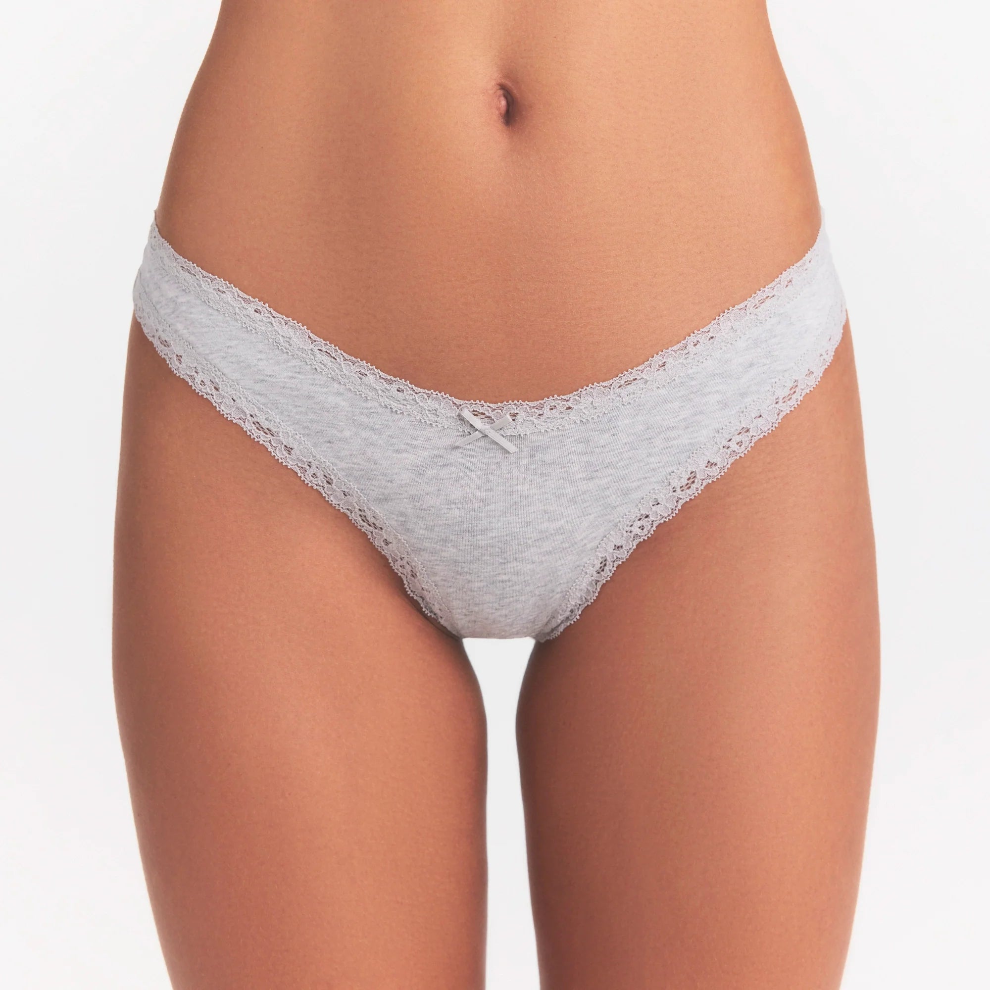 LIGHTWEIGHT COTTON LACE THONG | LIGHT HEATHER GREY ON A MODEL SIDE VIEW  | FOCUS: 0.0, 1.0, 0.9