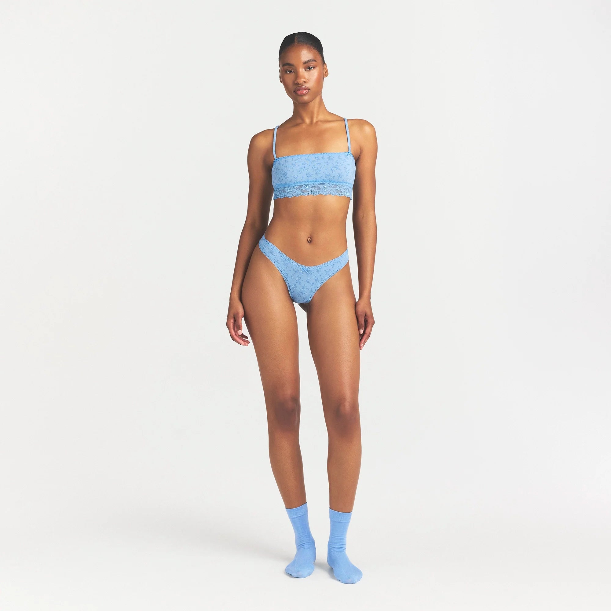 LIGHTWEIGHT COTTON LACE THONG | SURF DAINTY FLORAL PRINT ON A MODEL FRONT VIEW @ | FOCUS: 0.0, 1.0, 0.9