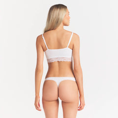 LIGHTWEIGHT COTTON LACE THONG | SNOW ON A MODEL SIDE VIEW  | FOCUS: 0.0, 1.0, 0.9