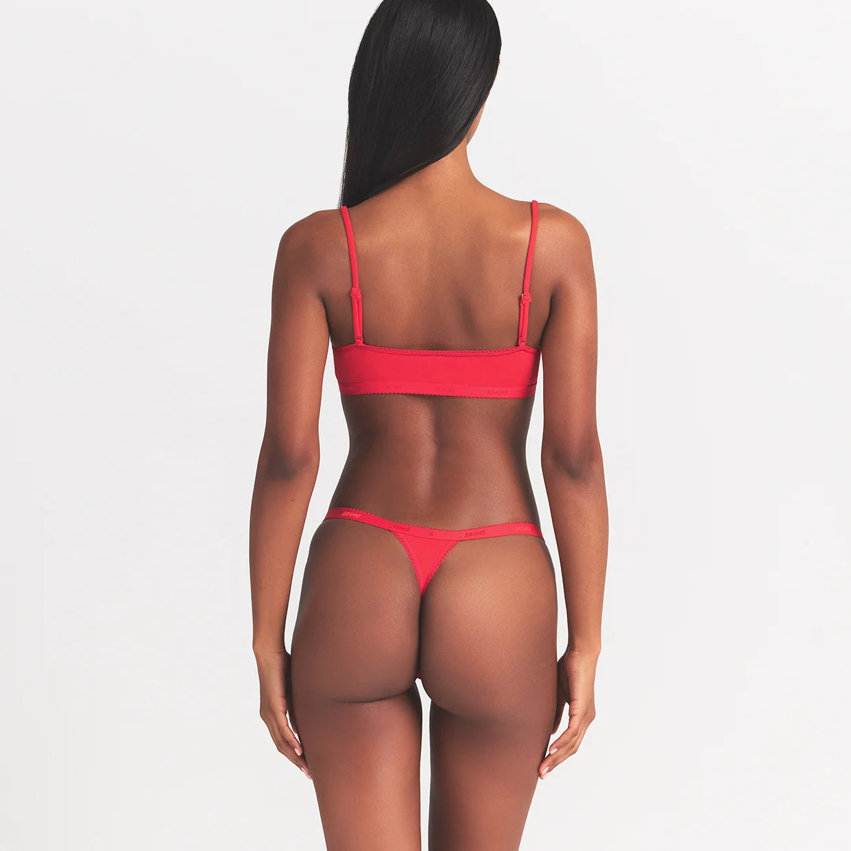 LIGHTWEIGHT COTTON LOGO PICOT THONG | RUBY TONAL ON A MODEL BACK VIEW @ | FOCUS: 0.0, 1.0, 0.9