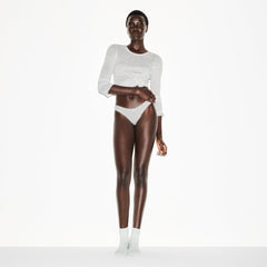 LIGHTWEIGHT COTTON POINTELLE LACE THONG | LIGHT HEATHER GREY ON A MODEL FRONT VIEW @ | FOCUS: 0.0, 1.0, 0.9