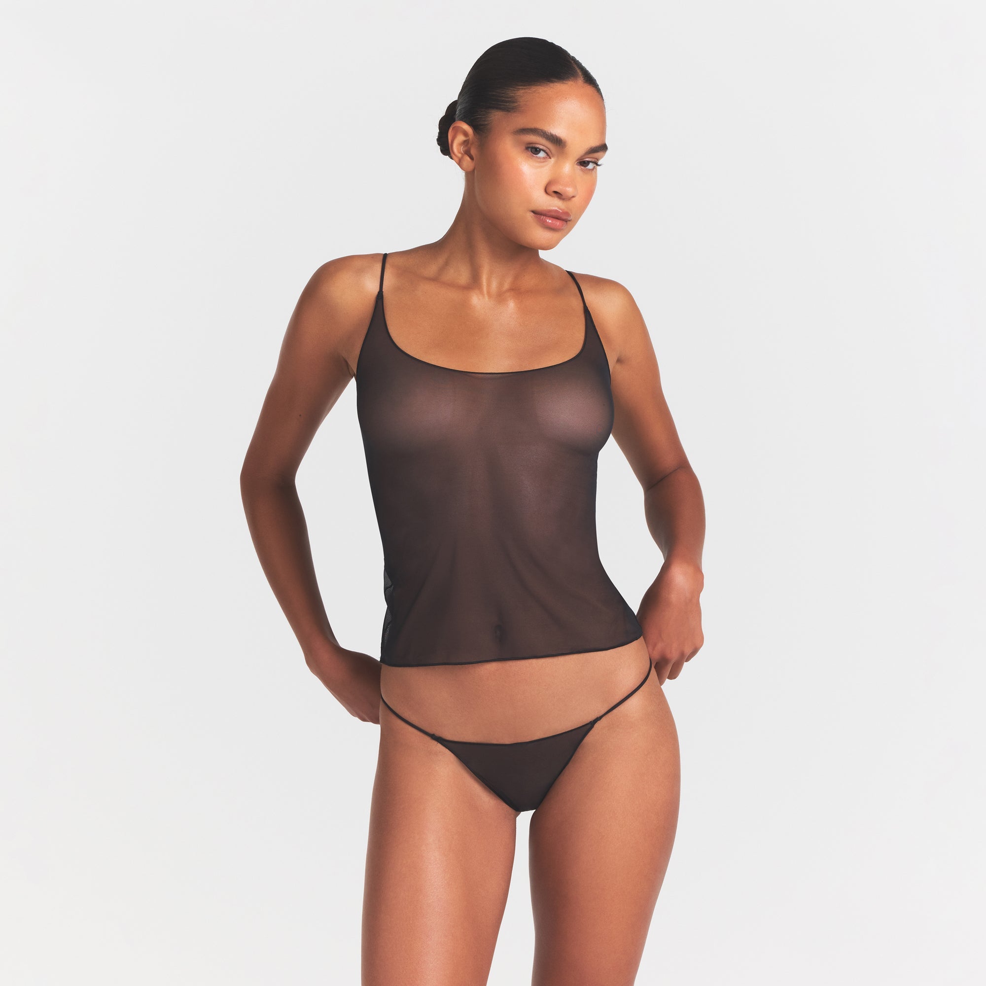 ULTRA FINE MESH STRING THONG | OBSIDIAN ON A MODEL SIDE VIEW @ | FOCUS: 0.0, 1.0, 0.9