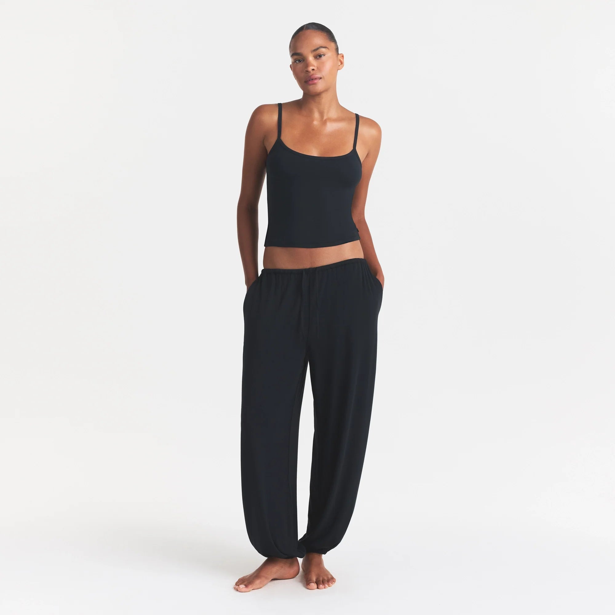 SKIMS SLEEP CAMI | ONYX ON A MODEL FRONT VIEW @ | FOCUS: 0.0, 1.0, 0.9