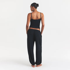SKIMS SLEEP CAMI | ONYX ON A MODEL FRONT VIEW @ | FOCUS: 0.0, 1.0, 0.9