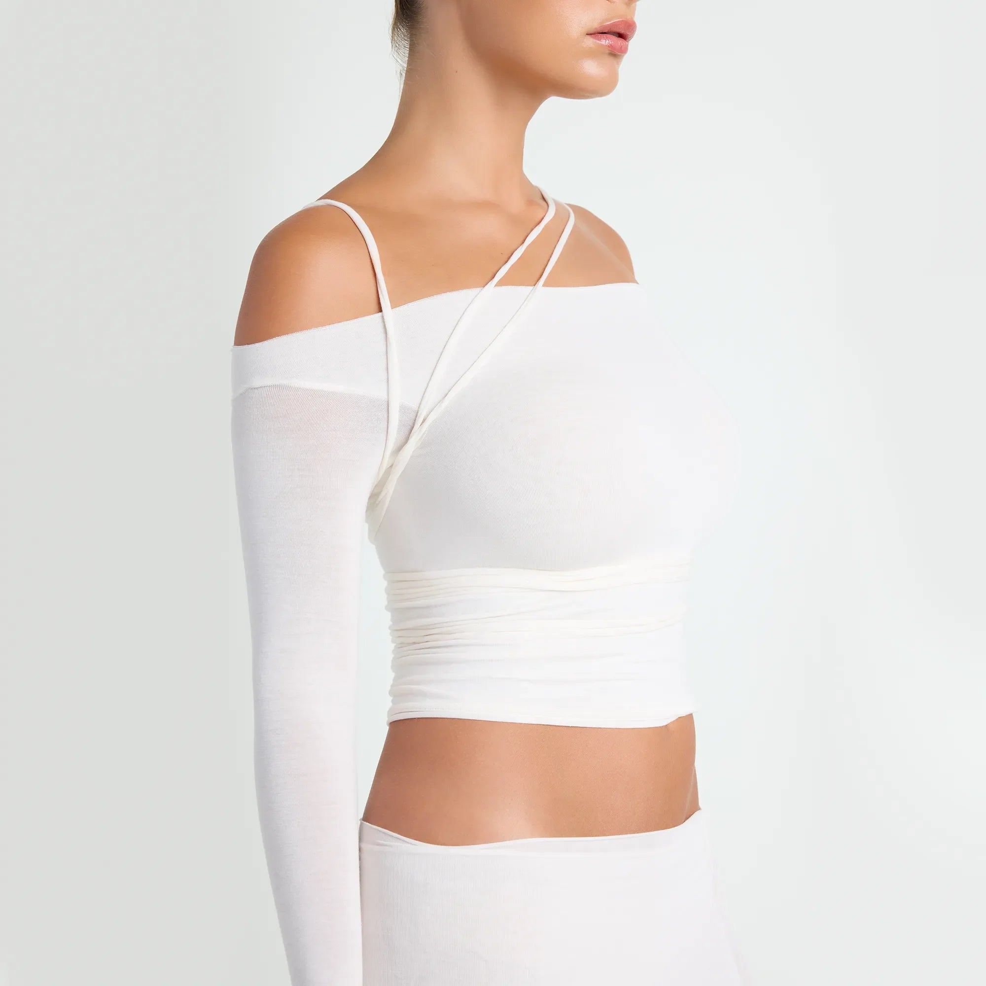 VETTESE X SKIMS SHEER MODAL OFF THE SHOULDER TOP | ECRU ON A MODEL SIDE VIEW | FOCUS: 0.0, 1.0, 0.9