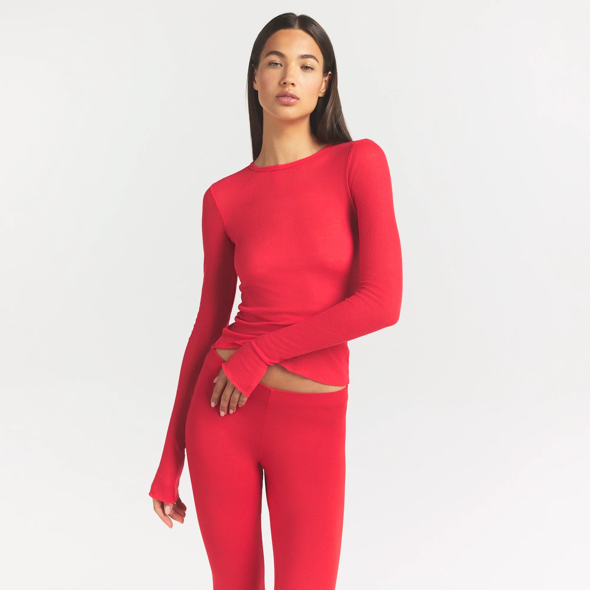 SHEER RIB LONG SLEEVE TOP | CARMINE ON A MODEL SIDE VIEW @ | FOCUS: 0.0, 1.0, 0.9