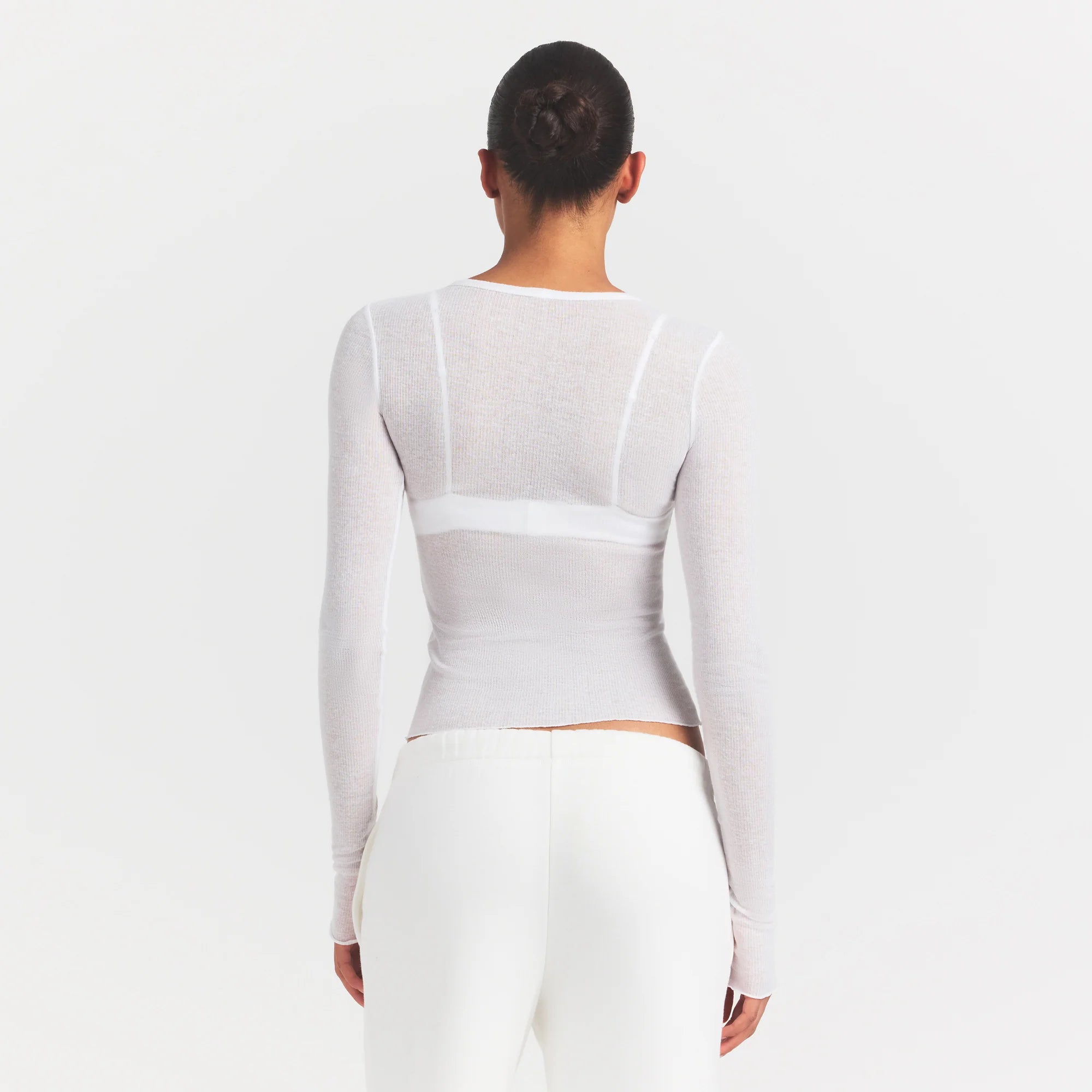 SHEER RIB LONG SLEEVE | SNOW ON A MODEL SIDE VIEW @ | FOCUS: 0.0, 1.0, 0.9