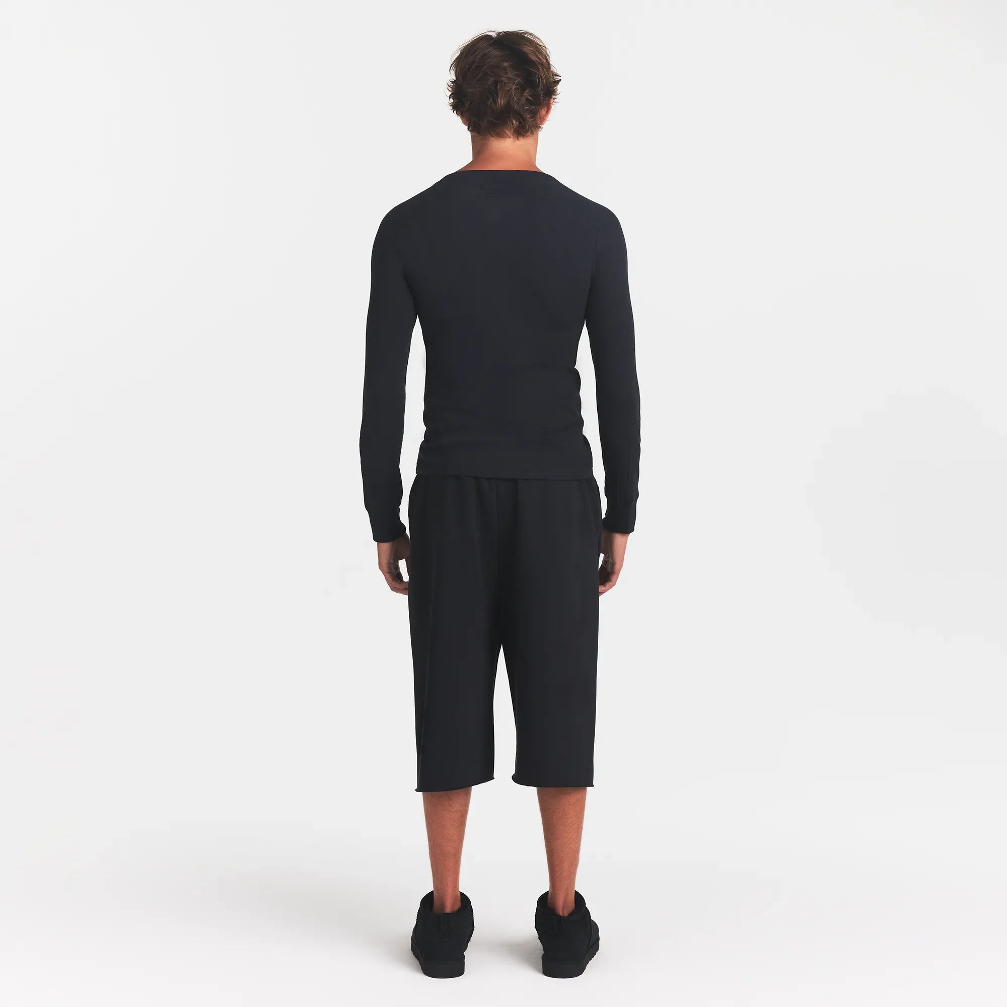 SKIMS COTTON RIB MENS HENLEY | ONYX ON A MODEL BACK VIEW @ | FOCUS: 0.0, 1.0, 0.9