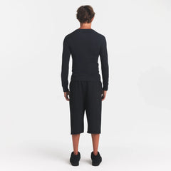 SKIMS COTTON RIB MENS HENLEY | ONYX ON A MODEL BACK VIEW @ | FOCUS: 0.0, 1.0, 0.9