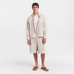 WOVEN MENS RELAXED SHIRT | STONE ON A MODEL FRONT VIEW @ | FOCUS: 0.0, 1.0, 0.9