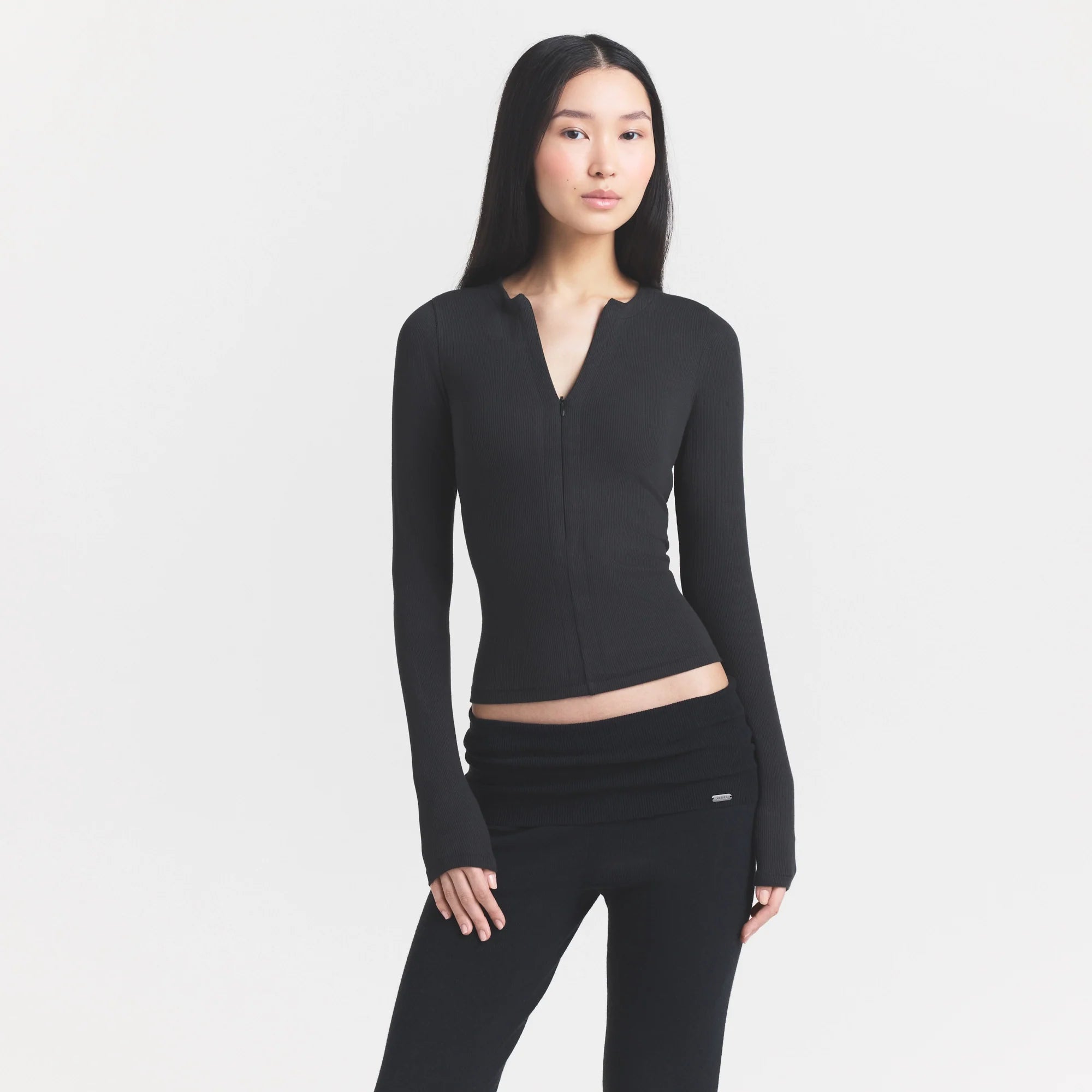 COTTON RIB ZIP UP TOP | SOOT ON A MODEL FRONT VIEW @ | FOCUS: 0.0, 1.0, 0.9
