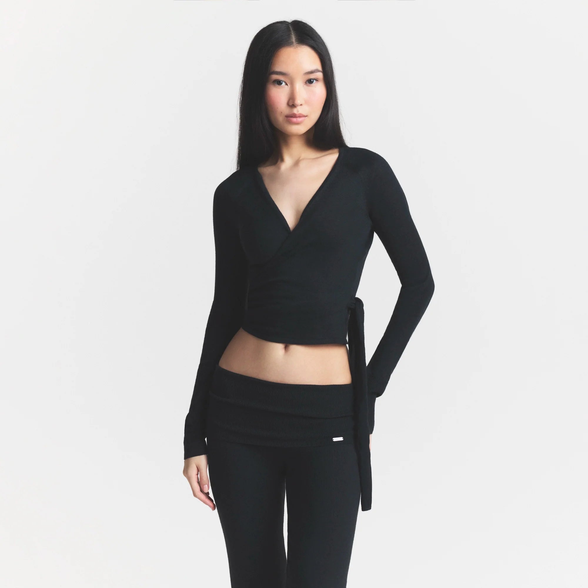 ESSENTIAL SWEATERS WRAP SWEATER | ONYX & LAYS FLAT ON A WHITE BACKGROUND | FLT @ | FOCUS: 0.0, 1.0, 0.9