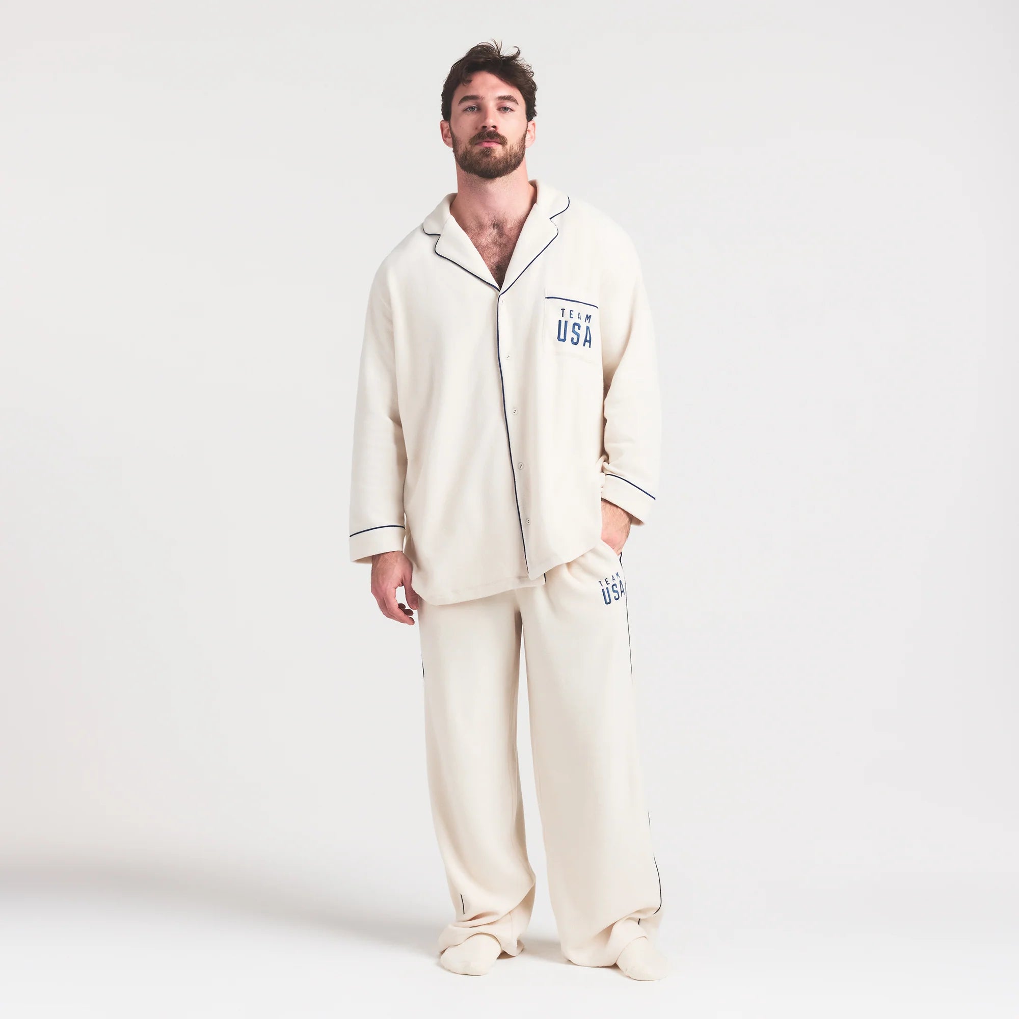SKIMS FOR TEAM USA UNISEX FLEECE OLYMPIC OVERSIZED SLEEP TOP | ECRU ON A MODEL FRONT VIEW @ | FOCUS: 0.0, 1.0, 0.9