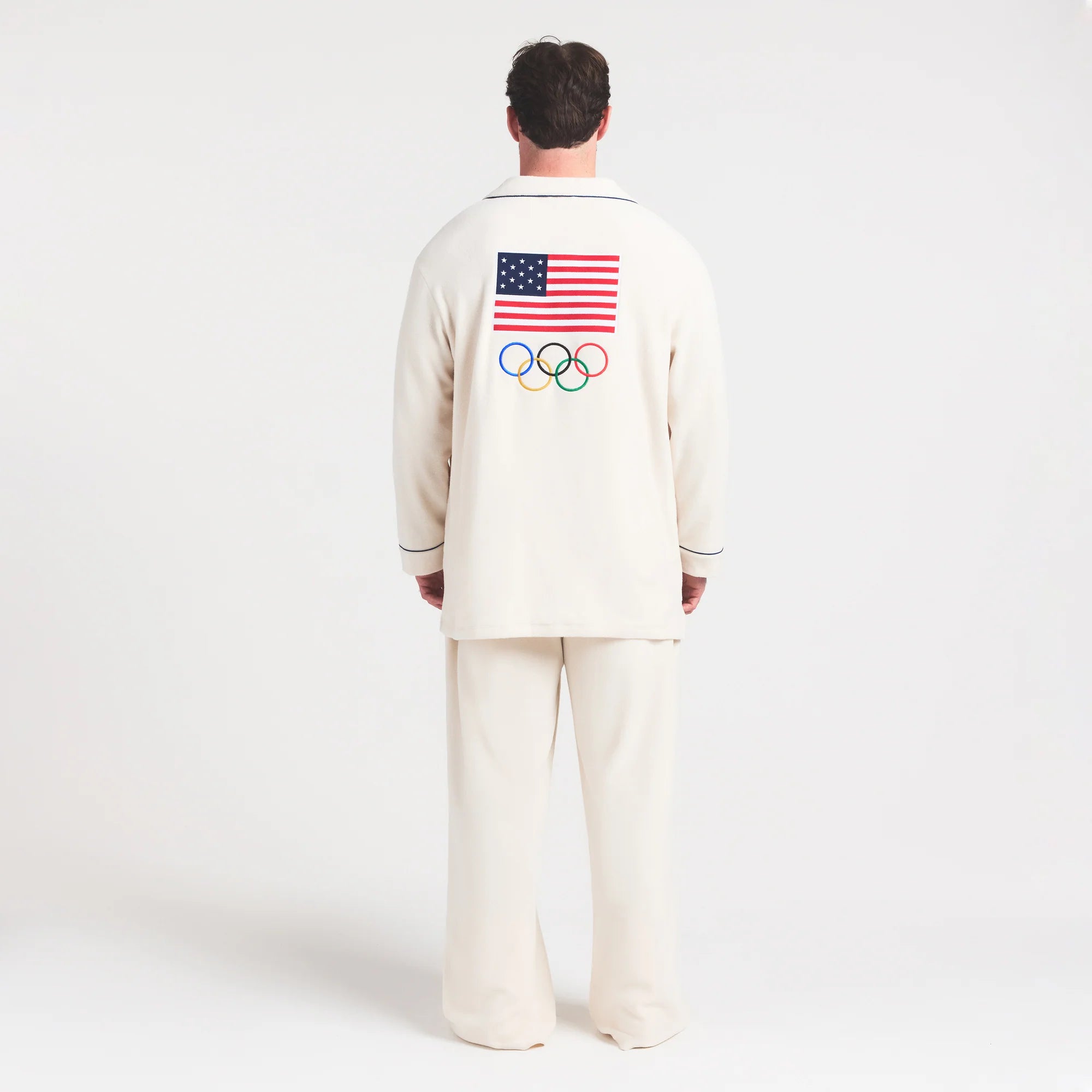 SKIMS FOR TEAM USA UNISEX FLEECE OLYMPIC OVERSIZED SLEEP TOP | ECRU ON A MODEL FRONT VIEW @ | FOCUS: 0.0, 1.0, 0.9