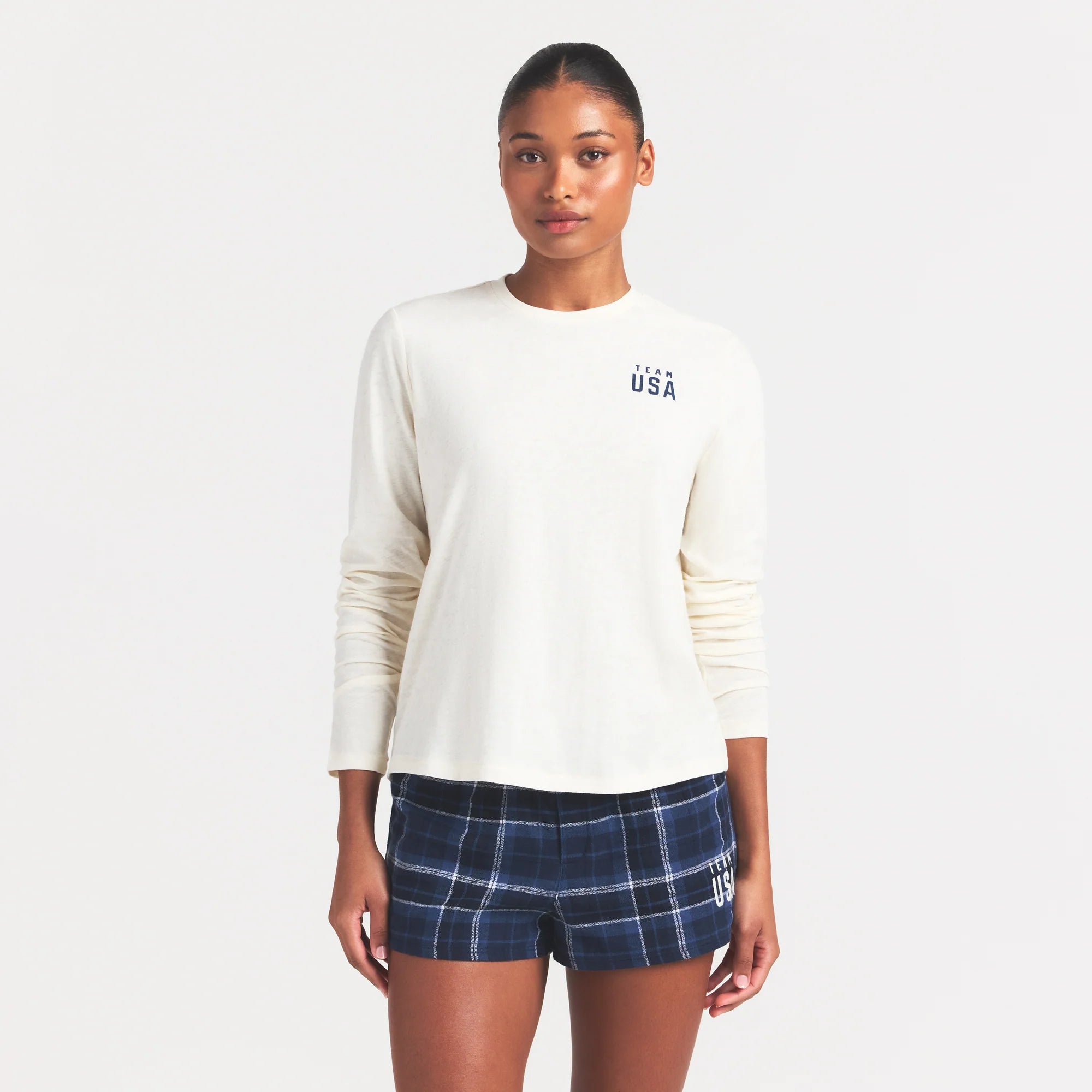 SKIMS FOR TEAM USA WORN IN JERSEY OLYMPIC LONG SLEEVE T-SHIRT | ECRU ON A MODEL SIDE VIEW @ | FOCUS: 0.0, 1.0, 0.9