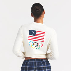 SKIMS FOR TEAM USA WORN IN JERSEY OLYMPIC LONG SLEEVE T-SHIRT | ECRU ON A MODEL SIDE VIEW @ | FOCUS: 0.0, 1.0, 0.9