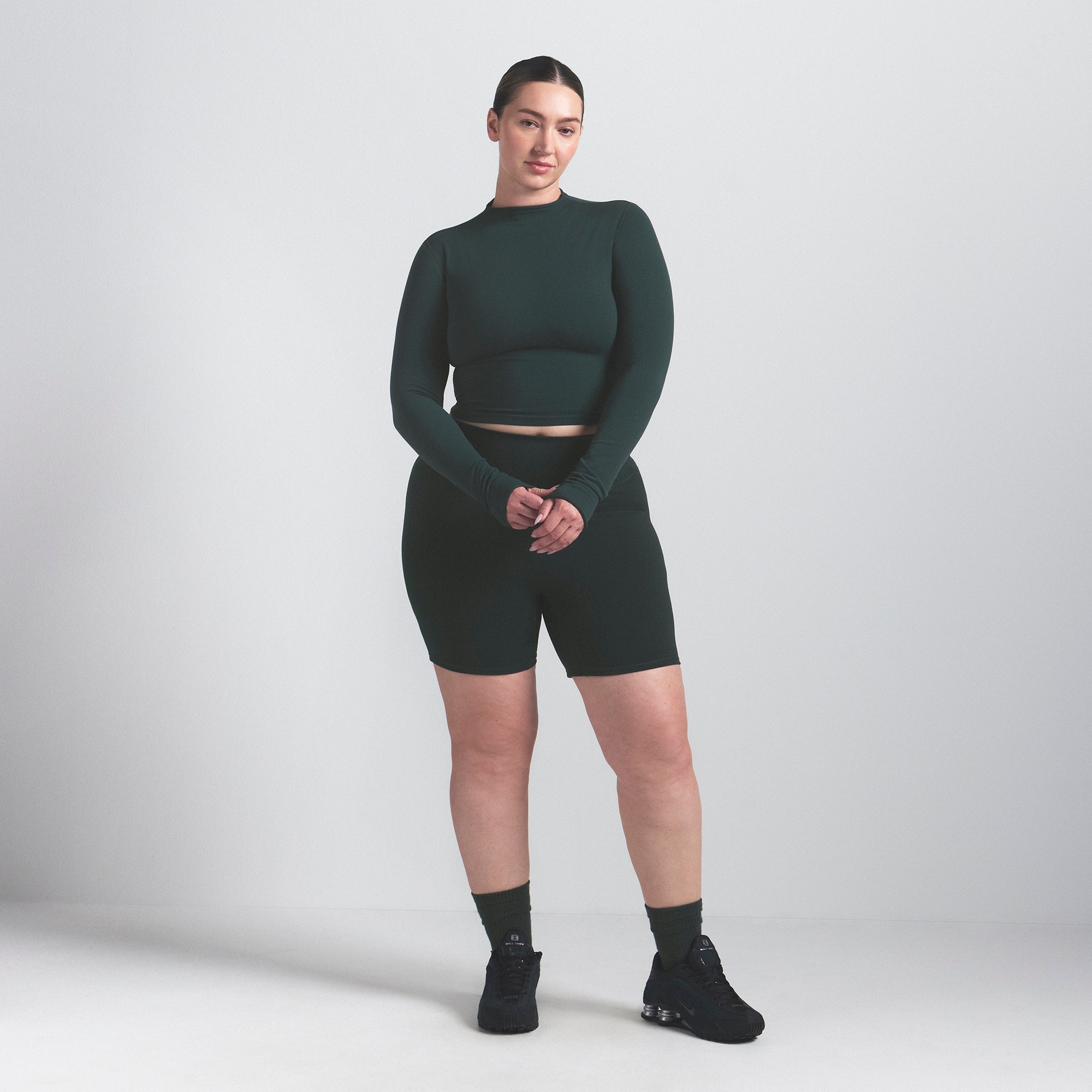 NikeSKIMS VINTAGE SEAMLESS MOCK NECK CROP TOP | DARK TEAL ON A MODEL FRONT VIEW @ | FOCUS: 0.0, 1.0, 0.9