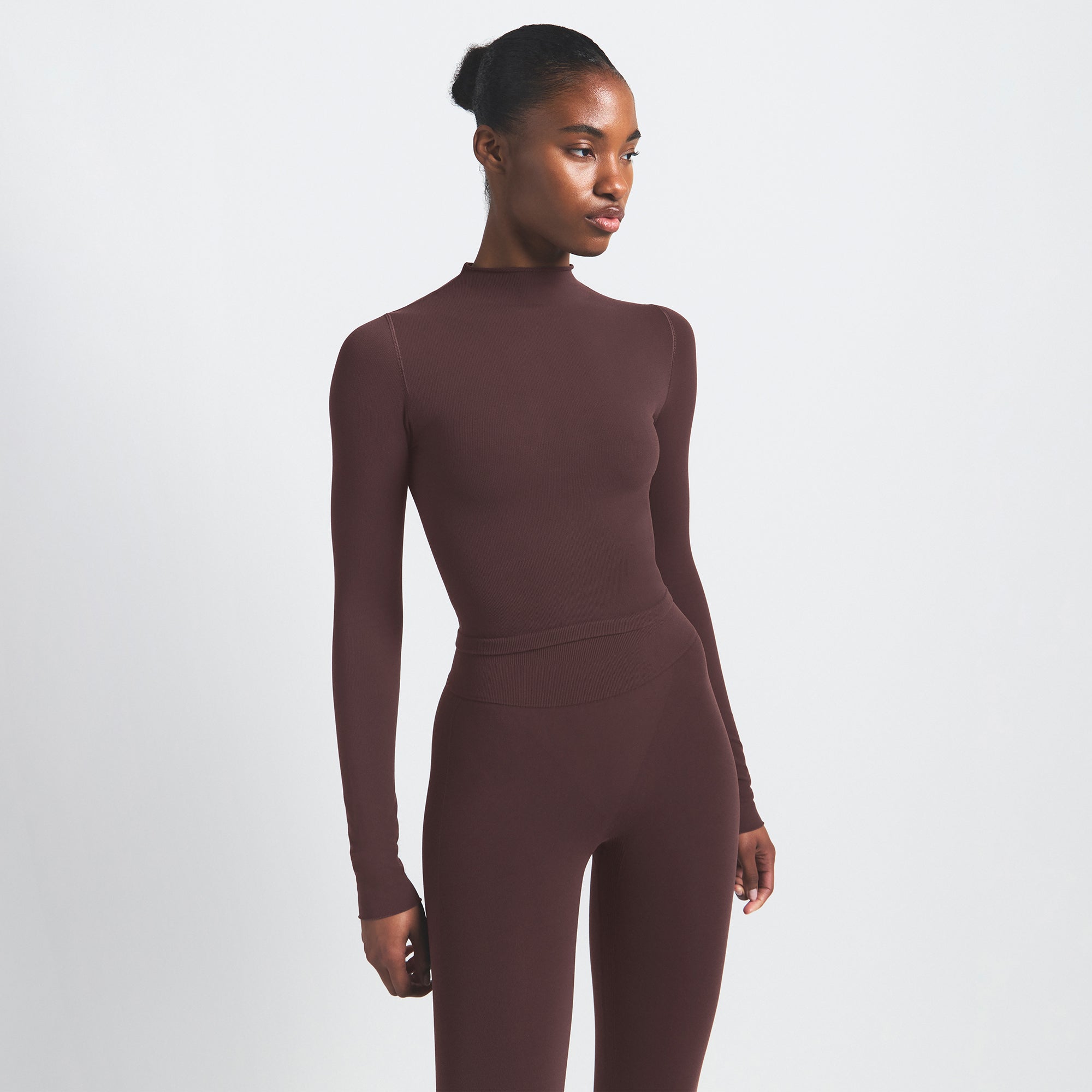 NikeSKIMS VINTAGE SEAMLESS MOCK NECK CROP TOP | PHOENIX ON A MODEL SIDE VIEW