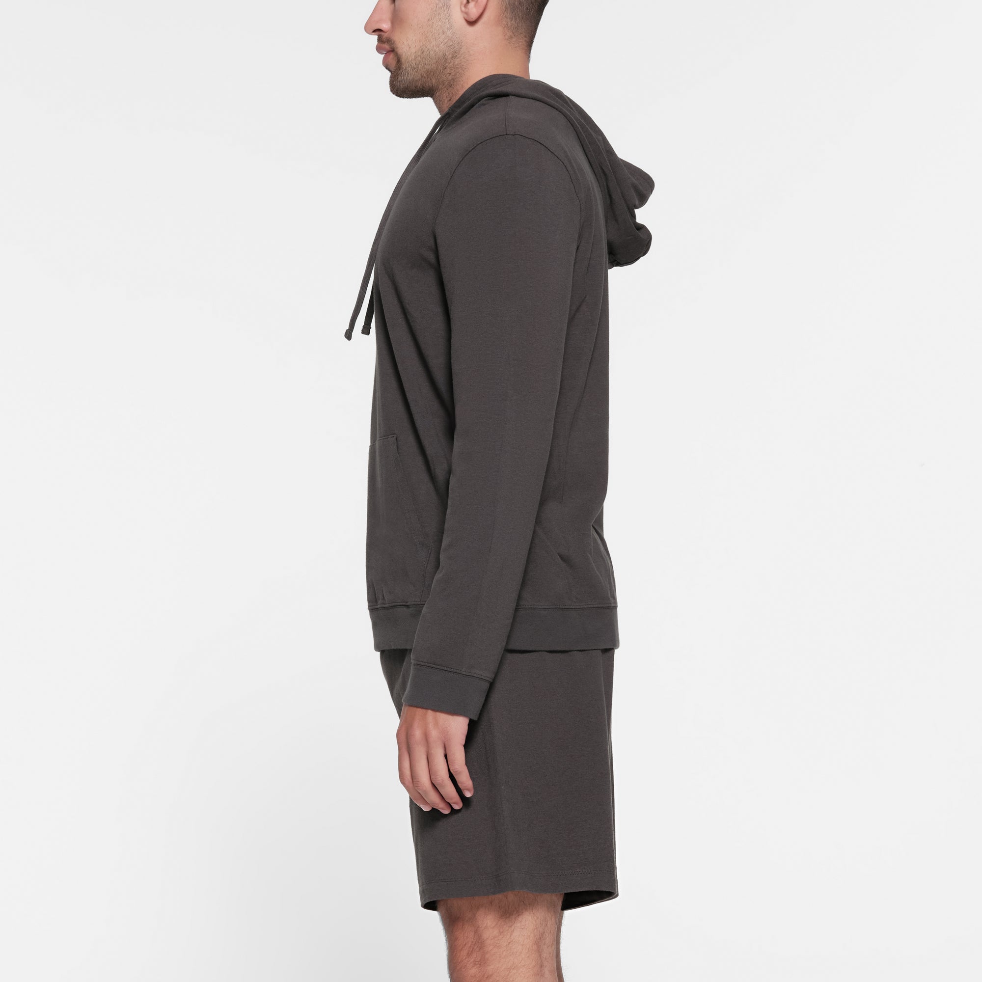 JERSEY LOUNGE MENS HOODIE | ASH ON A MODEL SIDE VIEW