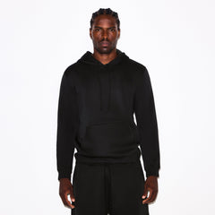 FLEECE LOUNGE MENS CLASSIC HOODIE | WASHED ONYX ON A MODEL SIDE VIEW @ | FOCUS: 0.0, 1.0, 0.9