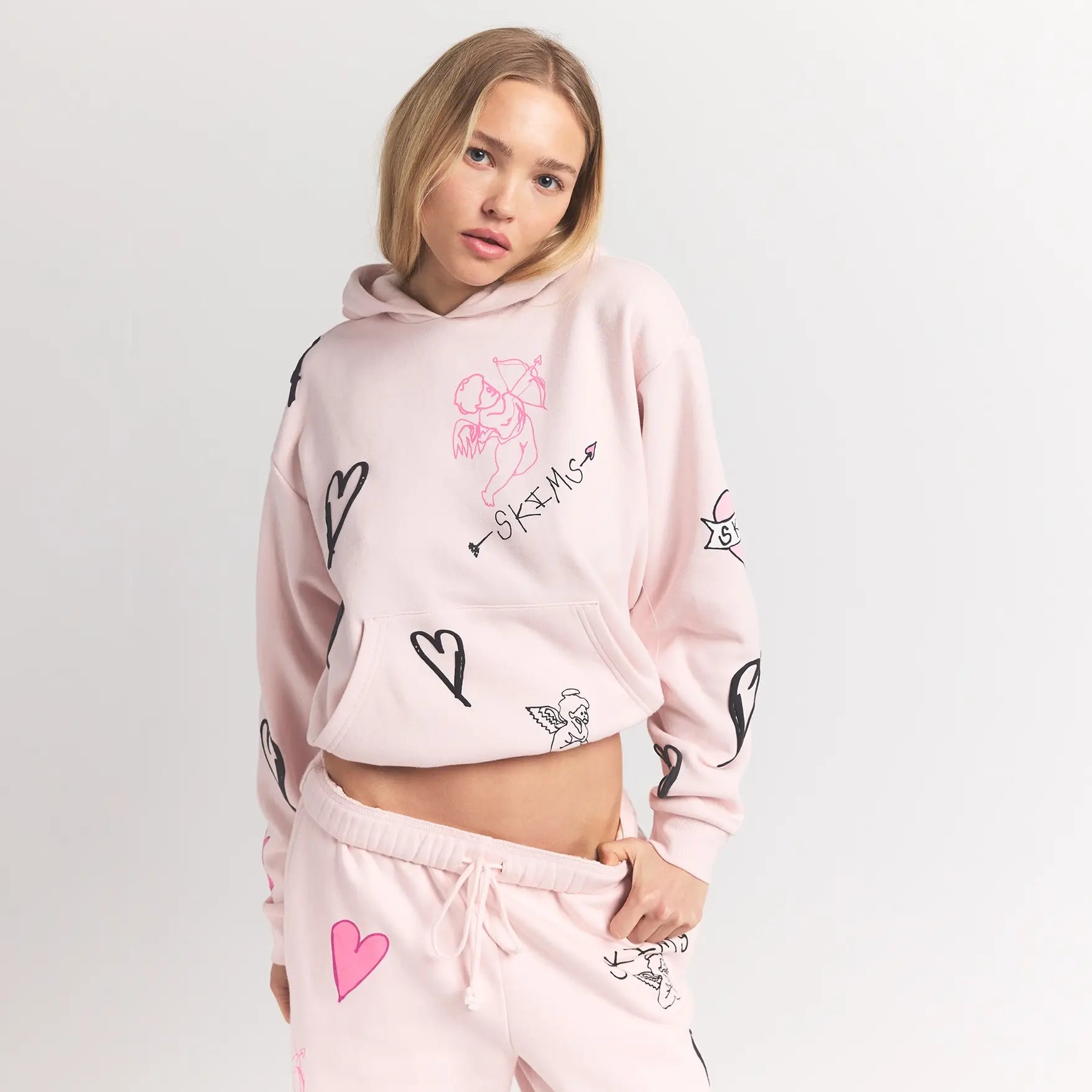 COTTON FLEECE CLASSIC HOODIE | BARELY PINK ANGEL SKETCH ON A MODEL FRONT VIEW @ | FOCUS: 0.0, 1.0, 0.9