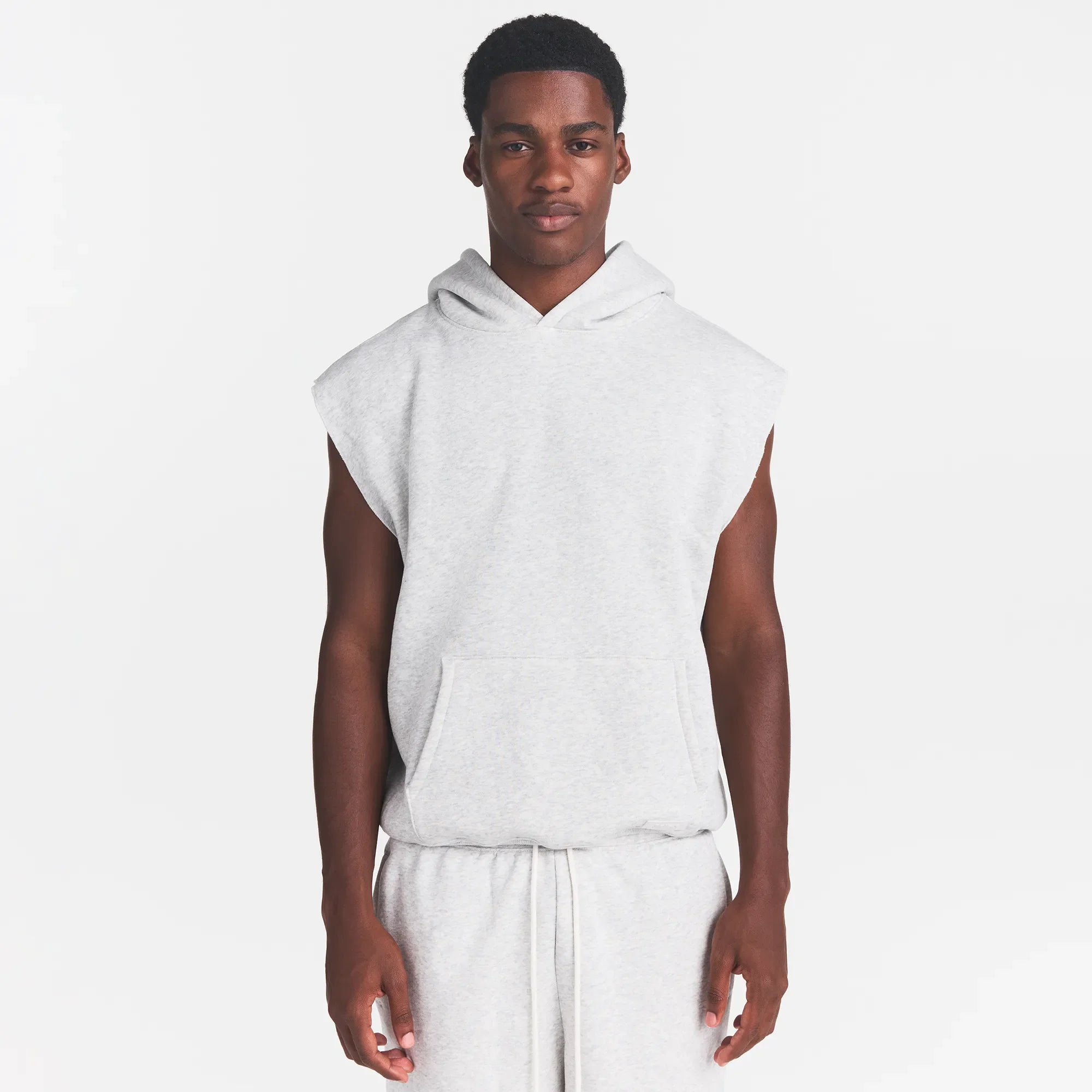 FLEECE LOUNGE MENS SLEEVELESS HOODIE | LIGHT HEATHER GREY ON A MODEL FRONT VIEW @ | FOCUS: 0.0, 1.0, 0.9