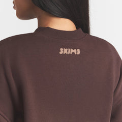 COTTON FLEECE BOMBER | ESPRESSO ON A MODEL SIDE VIEW @ | FOCUS: 0.0, 1.0, 0.9