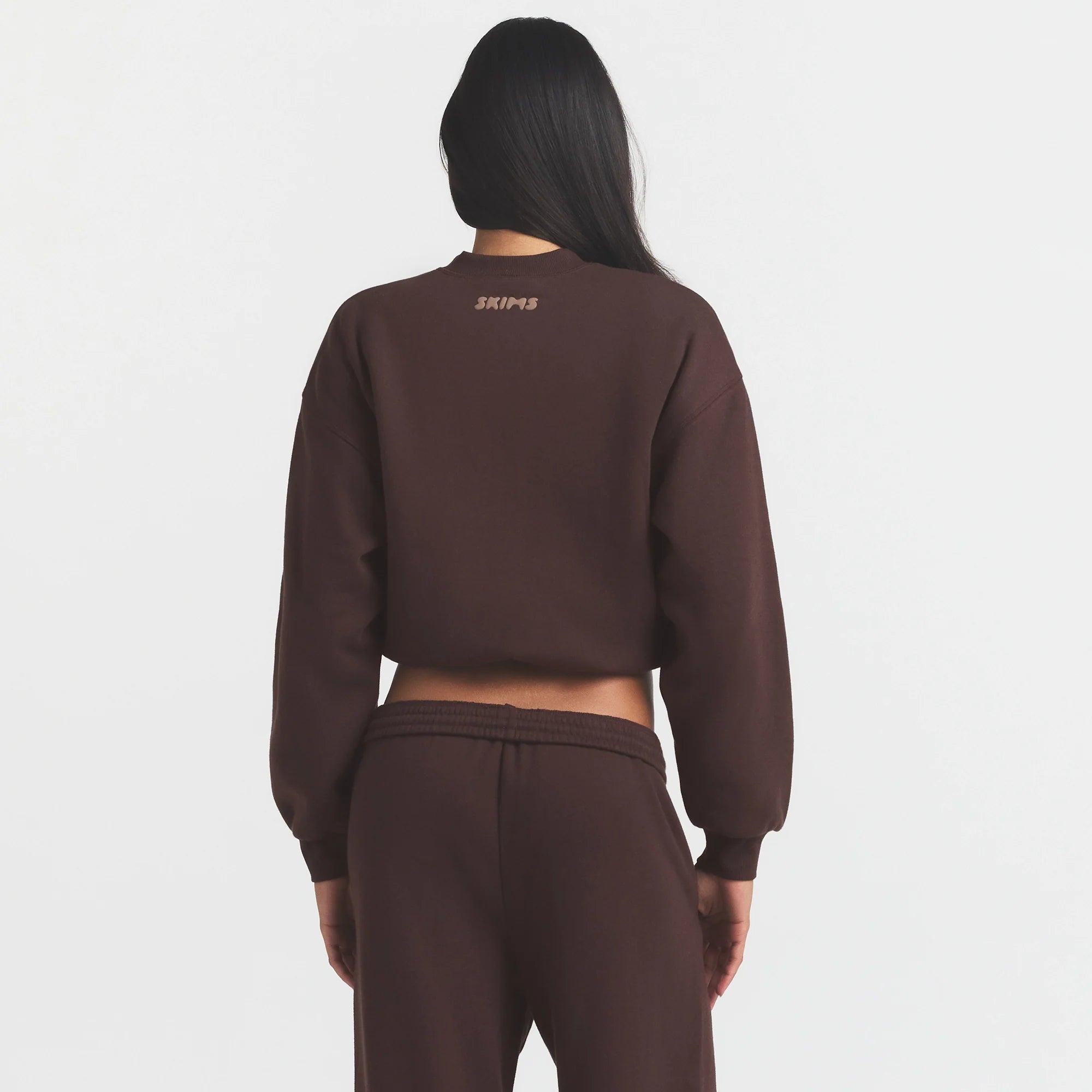 COTTON FLEECE BOMBER | ESPRESSO ON A MODEL SIDE VIEW @ | FOCUS: 0.0, 1.0, 0.9